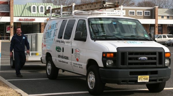 Cranbury Comfort Systems HVAC technician and work van